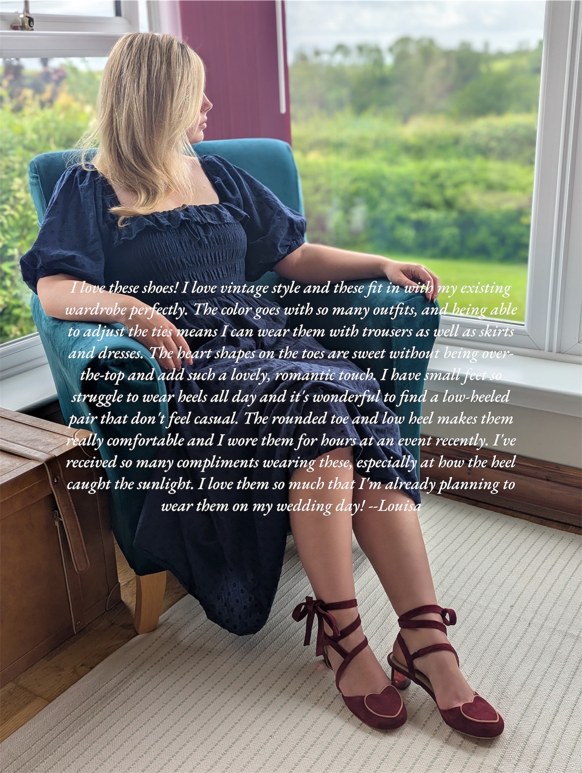 A girl in blue dress,  sitting on a chair showing her red shoes with love heart shaped top