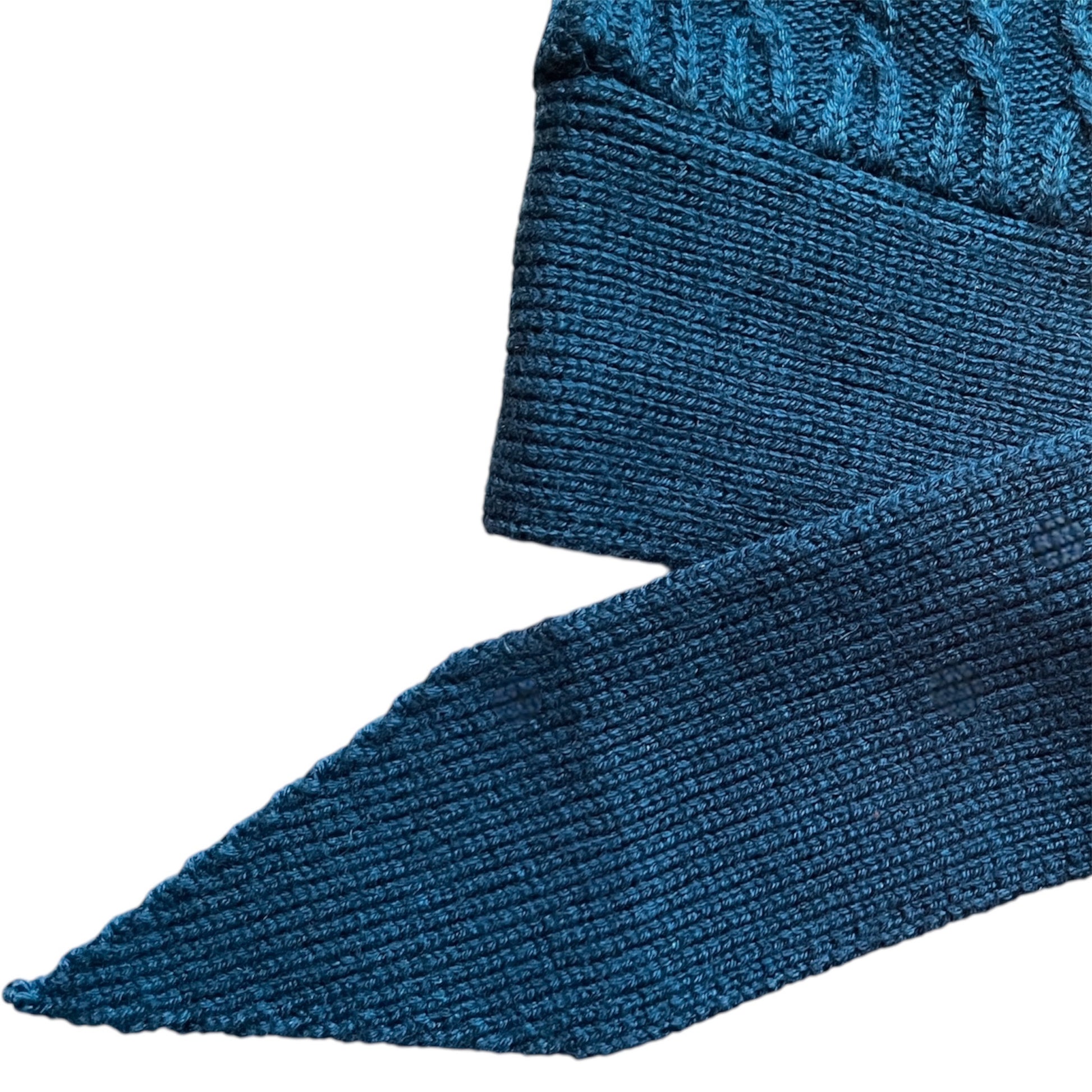 Close-up of a blue textured knitted belt
