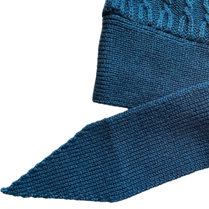 Close-up of a blue textured knitted belt