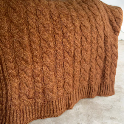 Close up of a Brown caramel merino wool knitted poncho