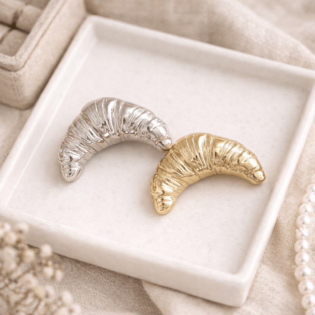 Vintage style Gold and silver croissant brooch in the trinket plate