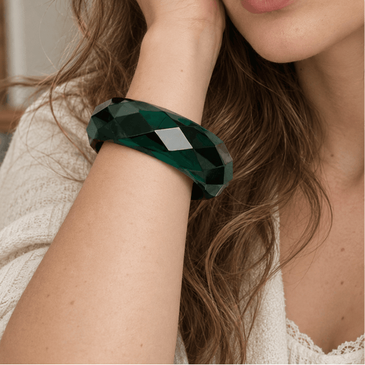 Woman wearing a green translucent bangle on her wrist 