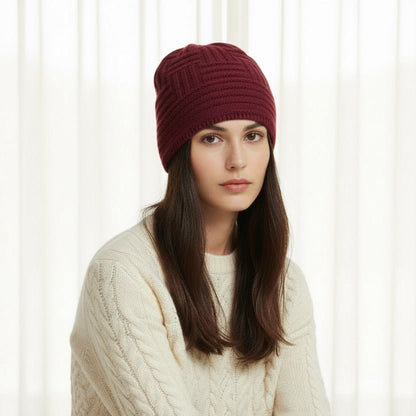 Woman wearing a red knitted merino wool  beanie 