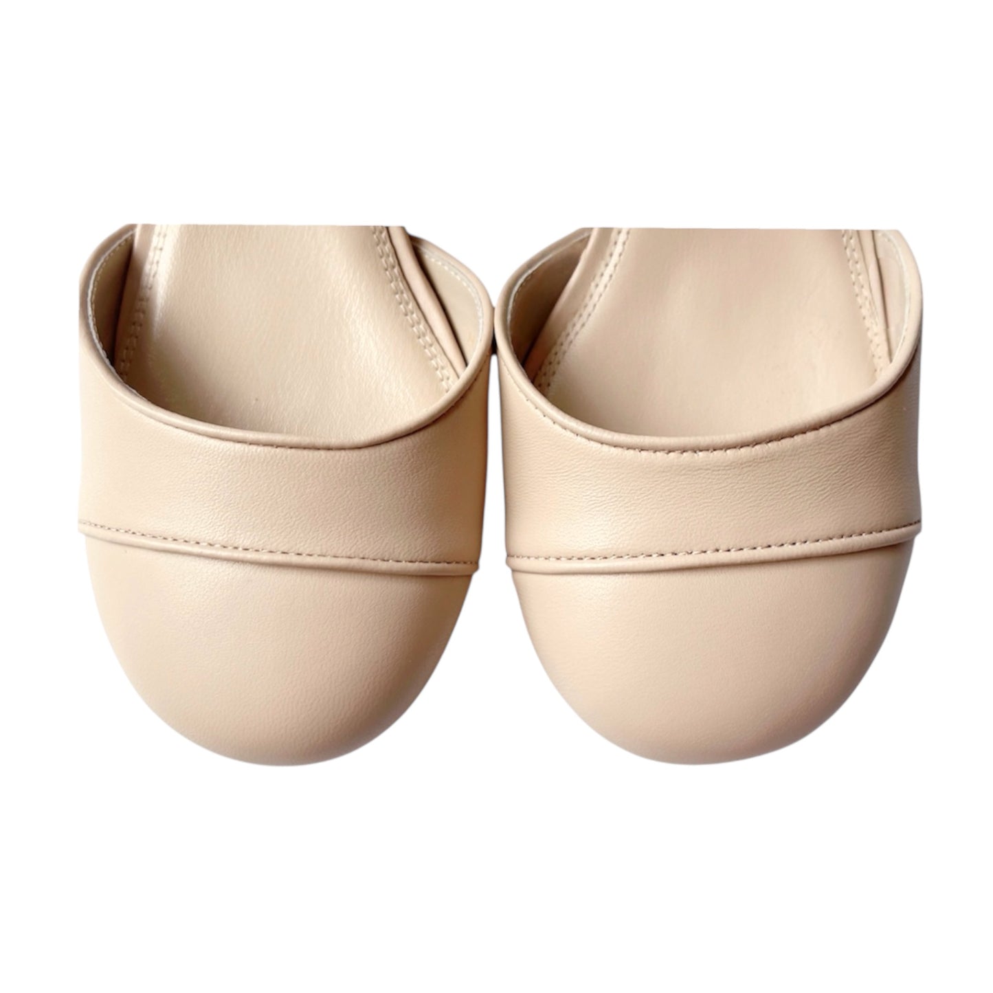 Toe box of beige Mary Jane pumps featuring piped decorative detail - handcrafted leather shoes