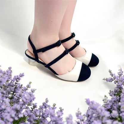 Model wearing black and cream Mary Jane pumps - vintage colour block heels