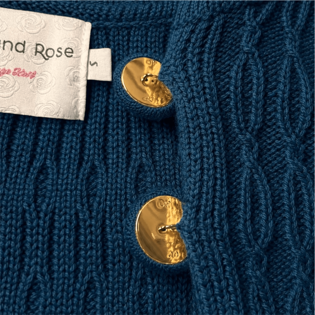 Vintage belted Chucky cable cardigan button close up 