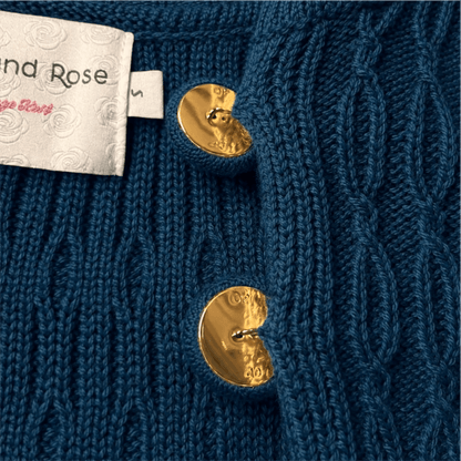 Vintage belted Chucky cable cardigan button close up 