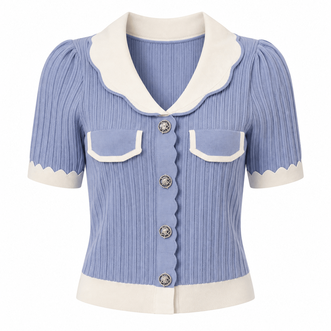 A short-sleeve ribbed knit cardigan in light blue with cream-colored collar, cuffs, hem, and pocket flaps, featuring decorative silver-tone buttons.