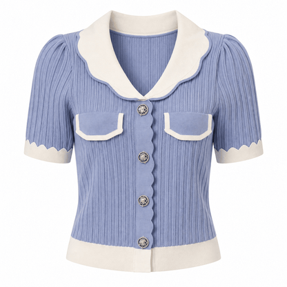 A short-sleeve ribbed knit cardigan in light blue with cream-colored collar, cuffs, hem, and pocket flaps, featuring decorative silver-tone buttons.