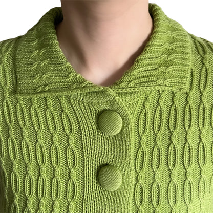 Close-up of a green knitted cardigan with knit covered buttons
