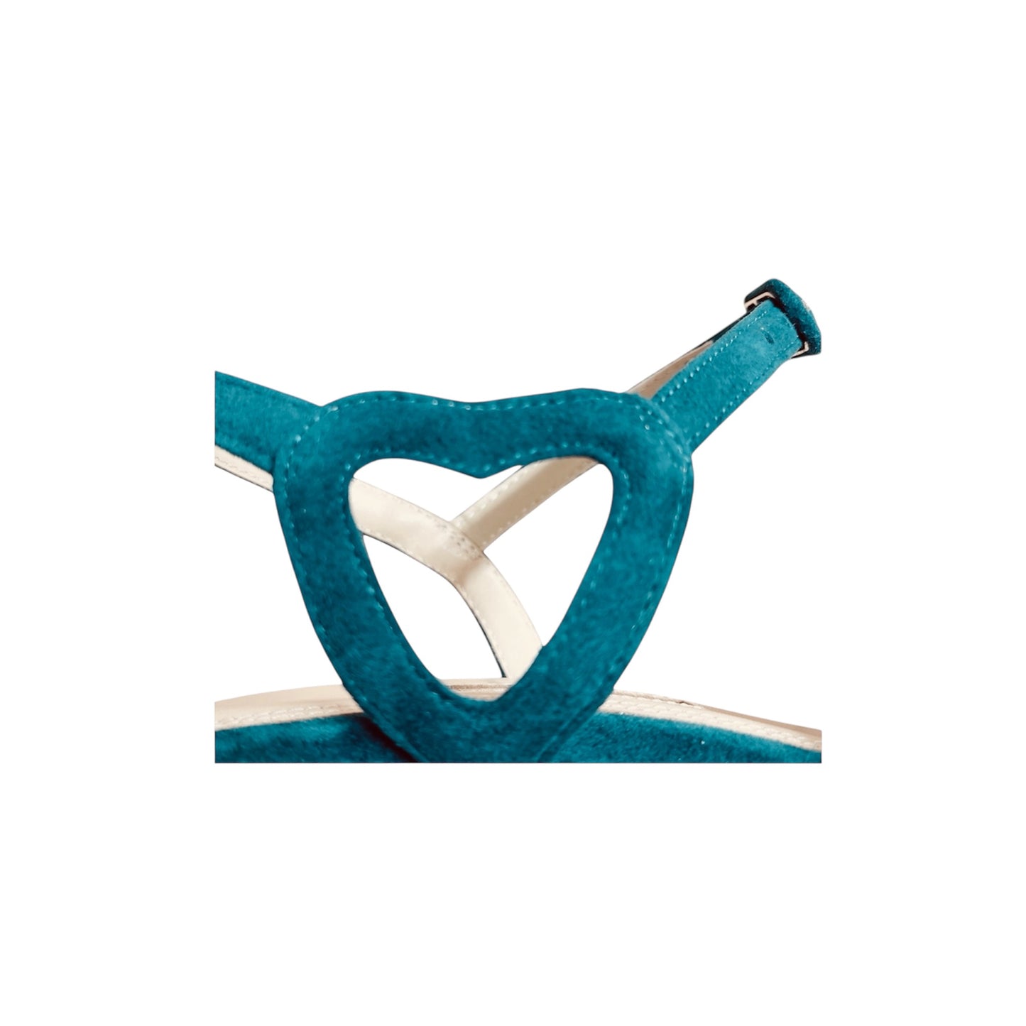 Heart-shaped side detail on green suede vintage pumps with pom-pom