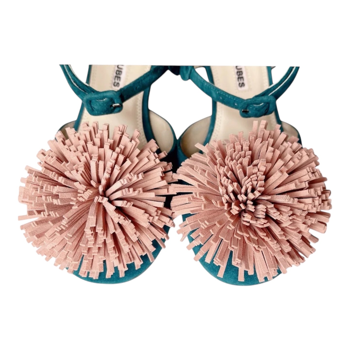 Decorative pom-pom embellishment detail on green suede pumps with crystal heels