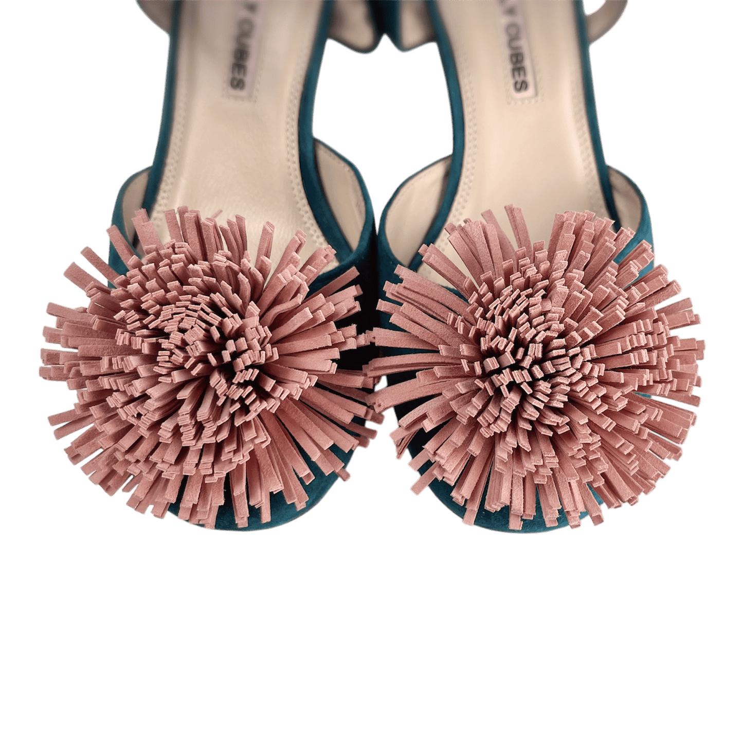 Decorative pom-pom embellishment detail on green suede Mary Jane shoes