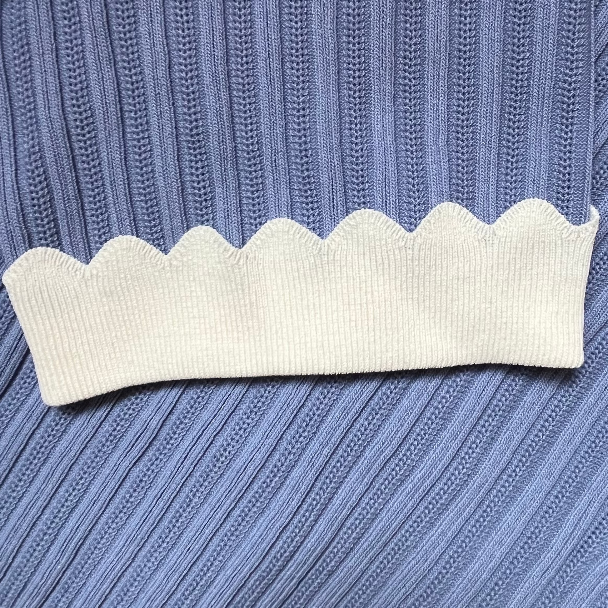 blue ribbed scallop hem on the sleeve